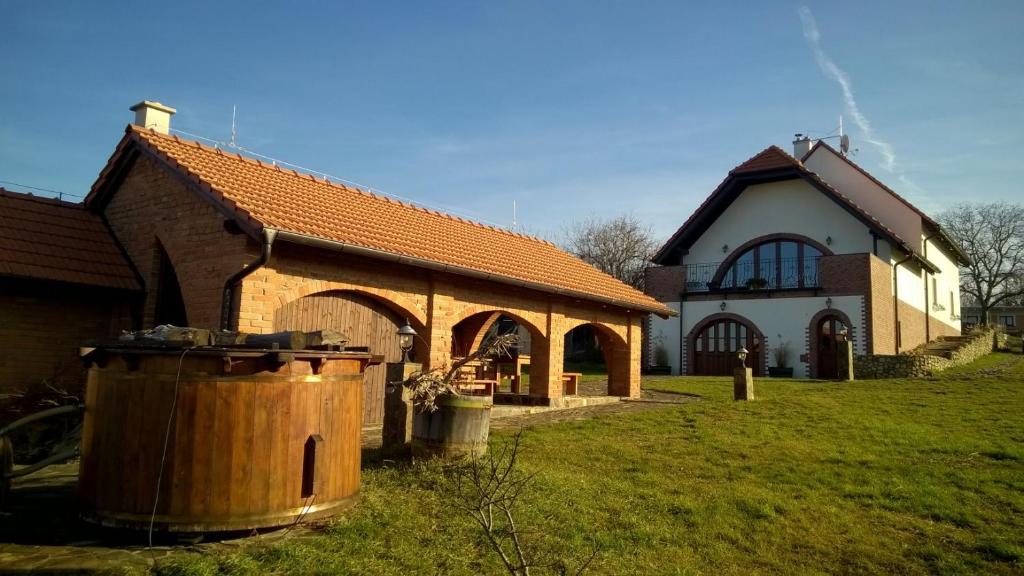 a large building with a large barrel in front of it at Penzión nad Skalicou in Skalica