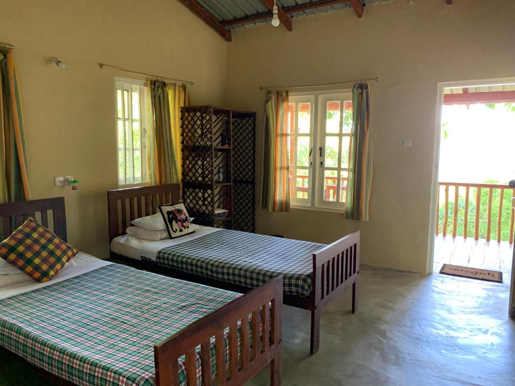Postel nebo postele na pokoji v ubytování Polwaththa Eco Lodges