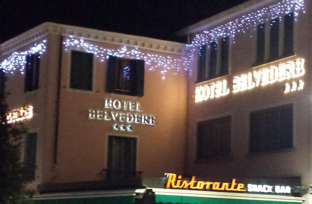 a building with christmas lights on the side of it at Hotel Belvedere in Venice-Lido