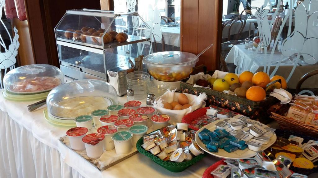 a buffet of food on a table in a room at Hotel Belvedere in Venice-Lido