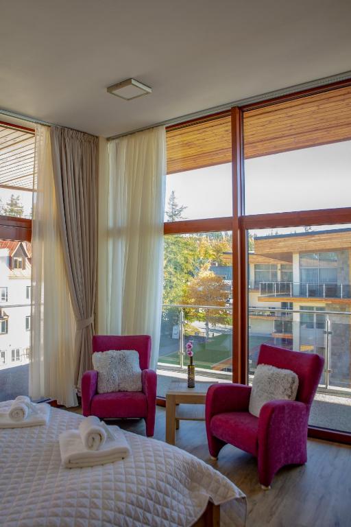 A bed or beds in a room at Apartmány Tatry