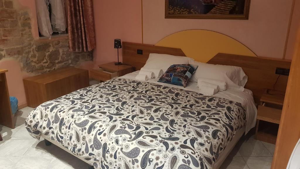 Posteľ alebo postele v izbe v ubytovaní Locanda Dalla Compagnia