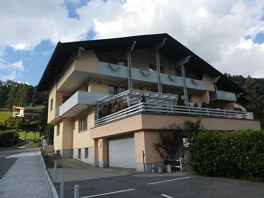a apartment building with a balcony and a parking lot at Thermenloft in Bad Kleinkirchheim