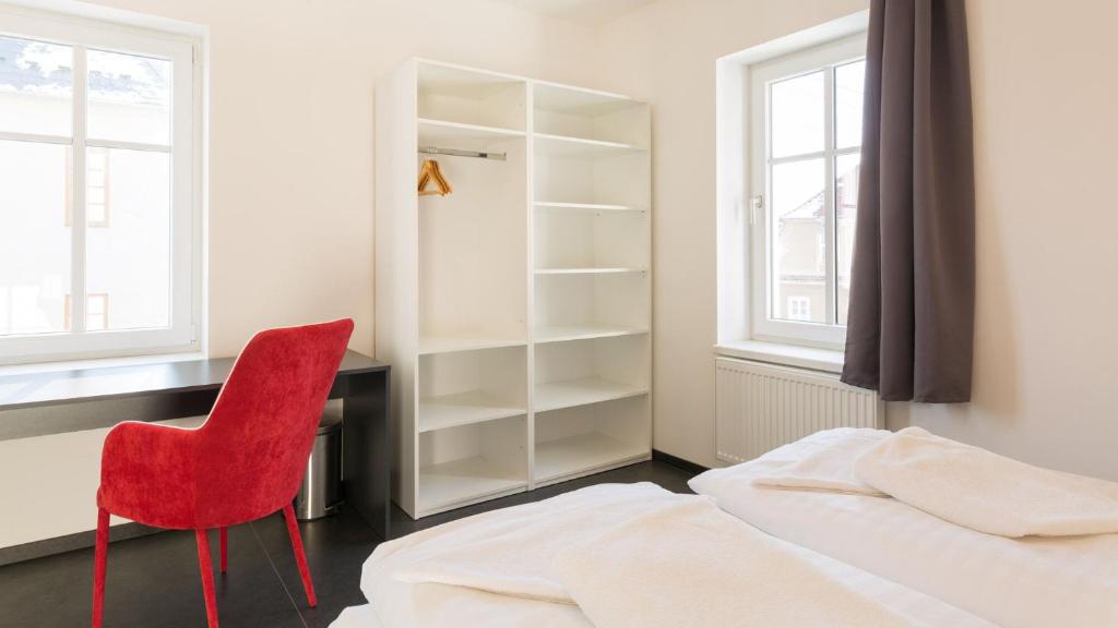 Postel nebo postele na pokoji v ubytování Pivovar Falkenštejn