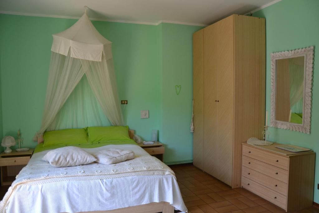 Postel nebo postele na pokoji v ubytování B&B Al Mare Di Greis