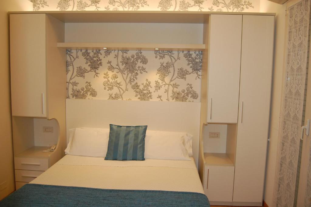 Postel nebo postele na pokoji v ubytování Hotel Rivazzurra