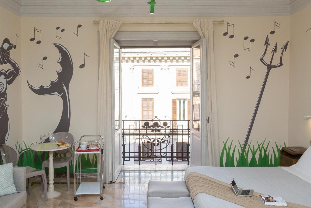 a bedroom with music notes on the wall at Tritone 125 Suite in Rome