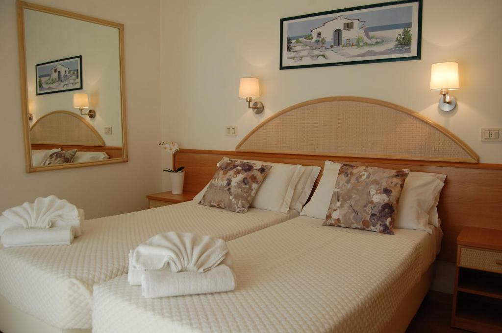 Postel nebo postele na pokoji v ubytování Hotel Rivazzurra
