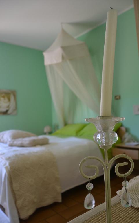 Postel nebo postele na pokoji v ubytování B&B Al Mare Di Greis