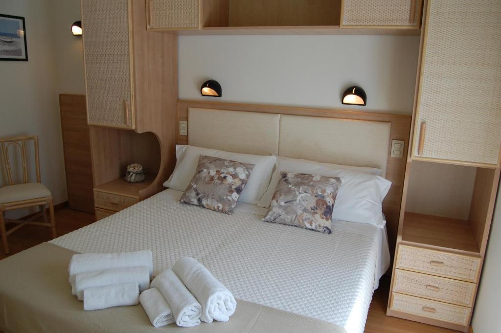 Postel nebo postele na pokoji v ubytování Hotel Rivazzurra