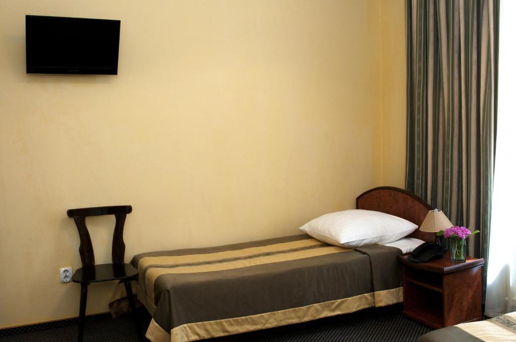 Postel nebo postele na pokoji v ubytování Wien Hotel
