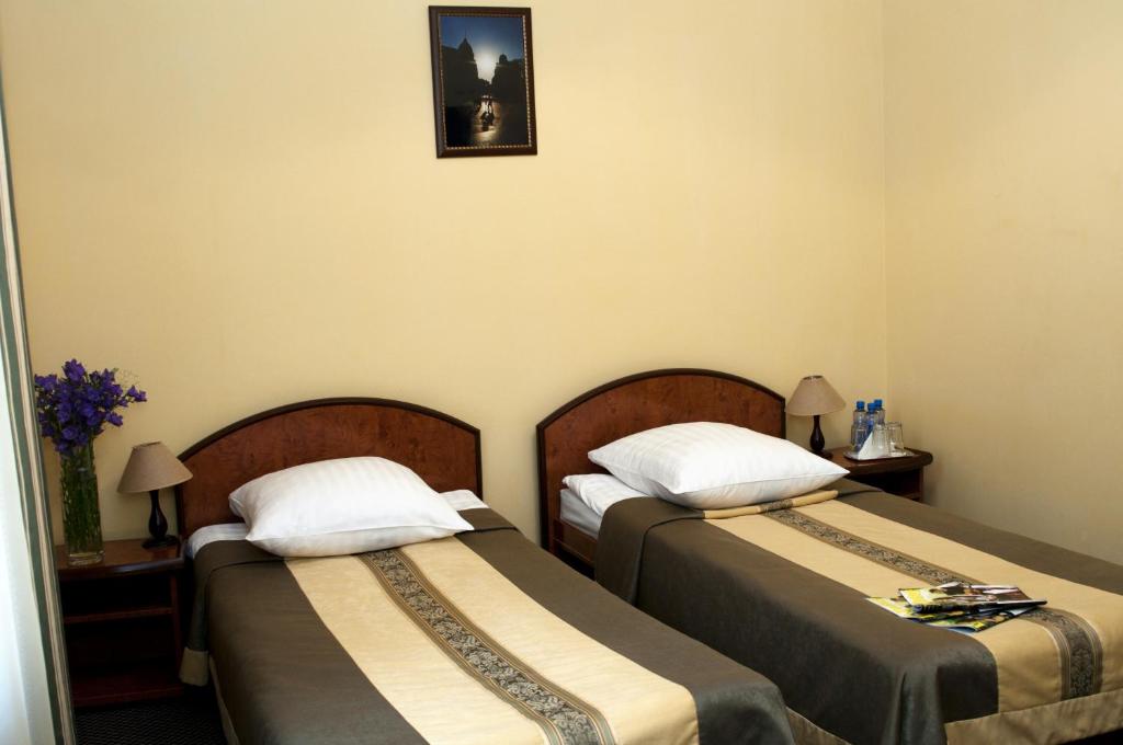 Postel nebo postele na pokoji v ubytování Wien Hotel