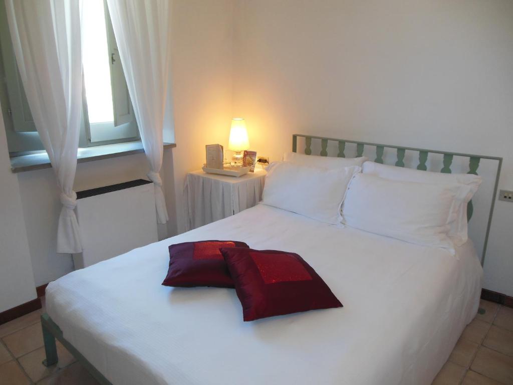 Postel nebo postele na pokoji v ubytování La Locanda Delle Donne Monache