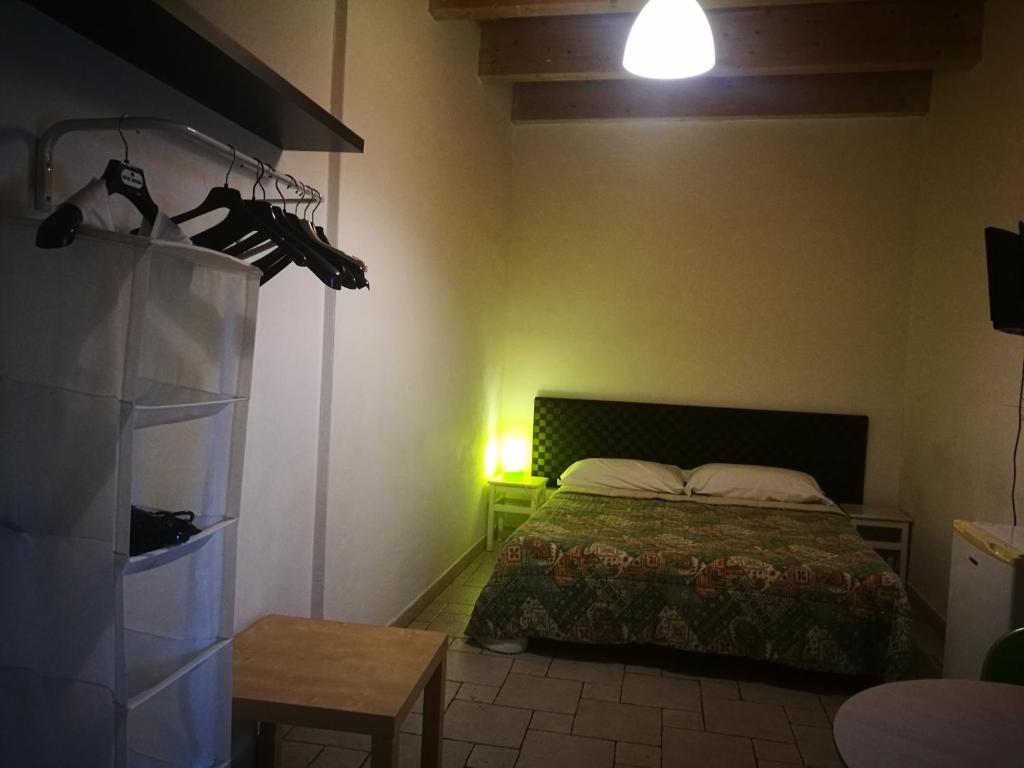 Postel nebo postele na pokoji v ubytování Corte Del Borgo Antico