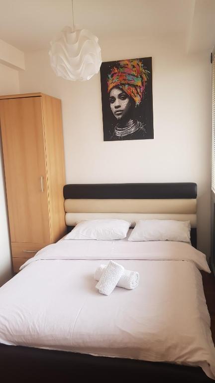 Postel nebo postele na pokoji v ubytování Apartman Panorama 3 Glavna ulica