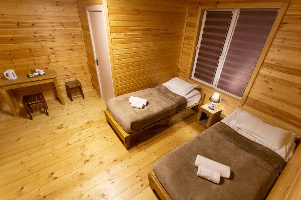 Postel nebo postele na pokoji v ubytování Cottage Shgedi