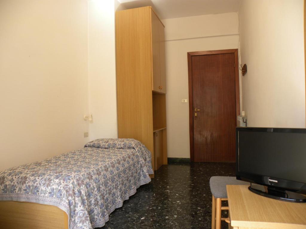 Postel nebo postele na pokoji v ubytování Albergo La Neigra