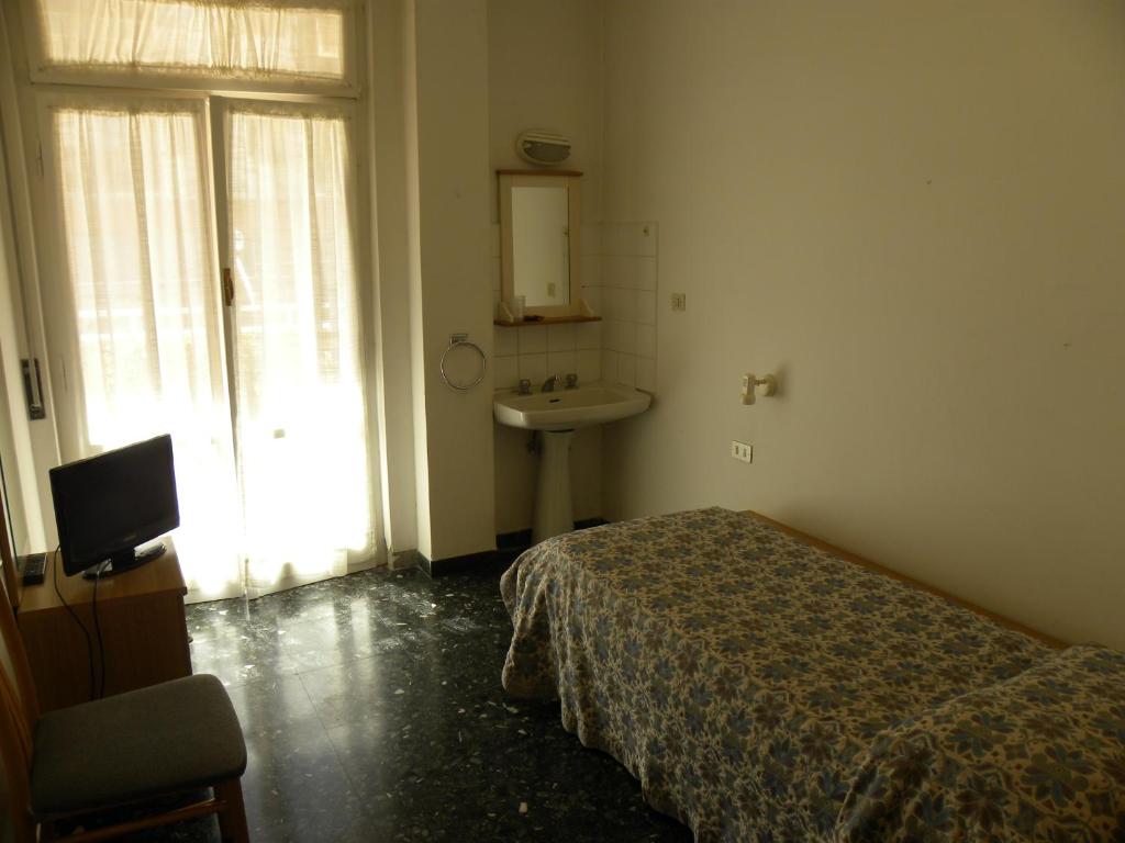 Postel nebo postele na pokoji v ubytování Albergo La Neigra