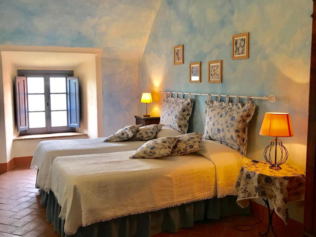 Postel nebo postele na pokoji v ubytování Il Borghetto Tuscan Holidays