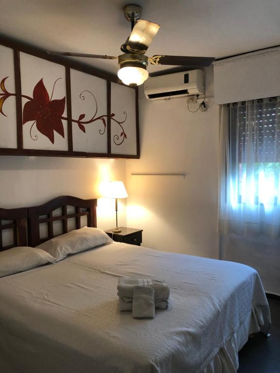 Säng eller sängar i ett rum på Laerte Hotel Mendoza