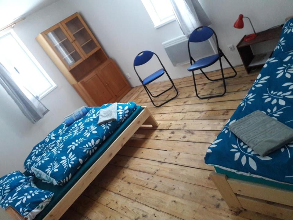 Postel nebo postele na pokoji v ubytování Apartmán pod Mariánskou horou