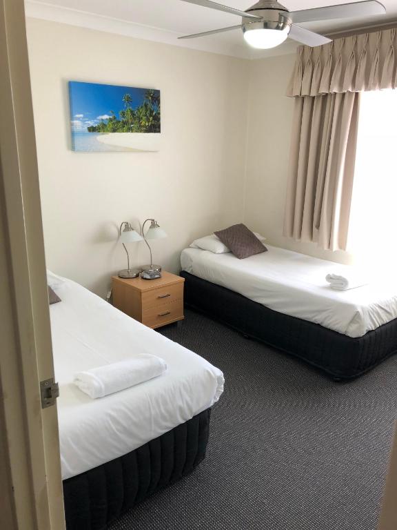 Postel nebo postele na pokoji v ubytování Beaches Serviced Apartments