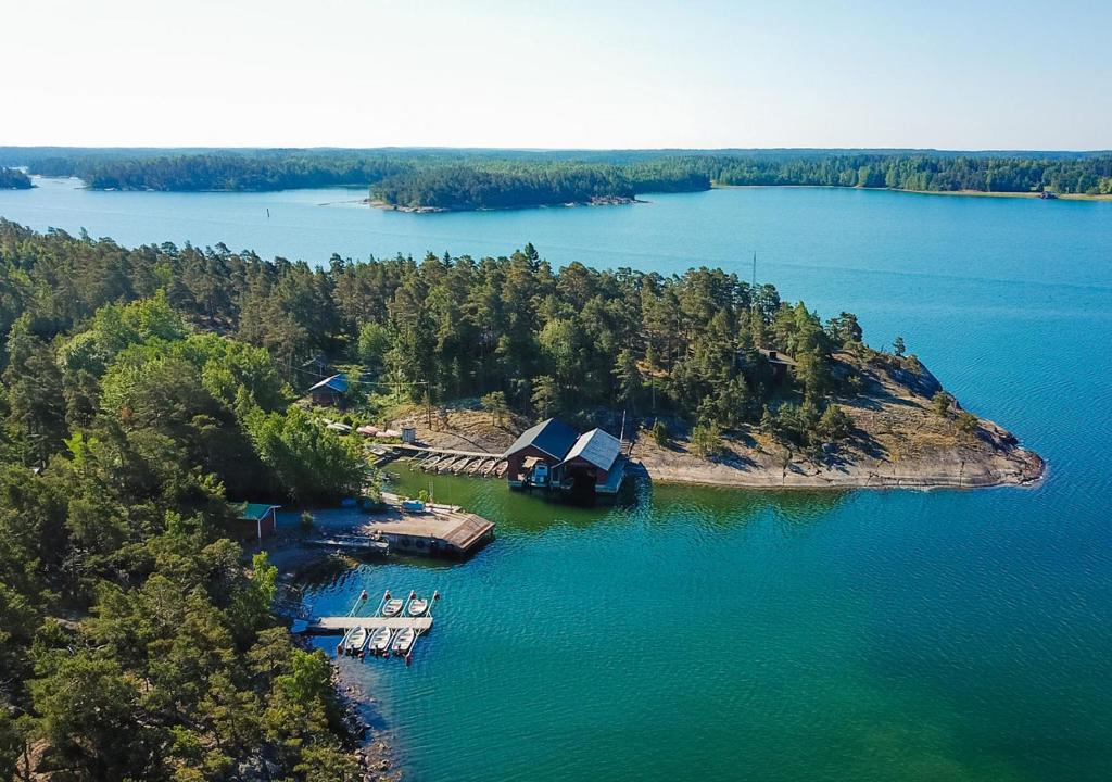 an aerial view of a house on an island in the water at Björkholm mökit in Pargas