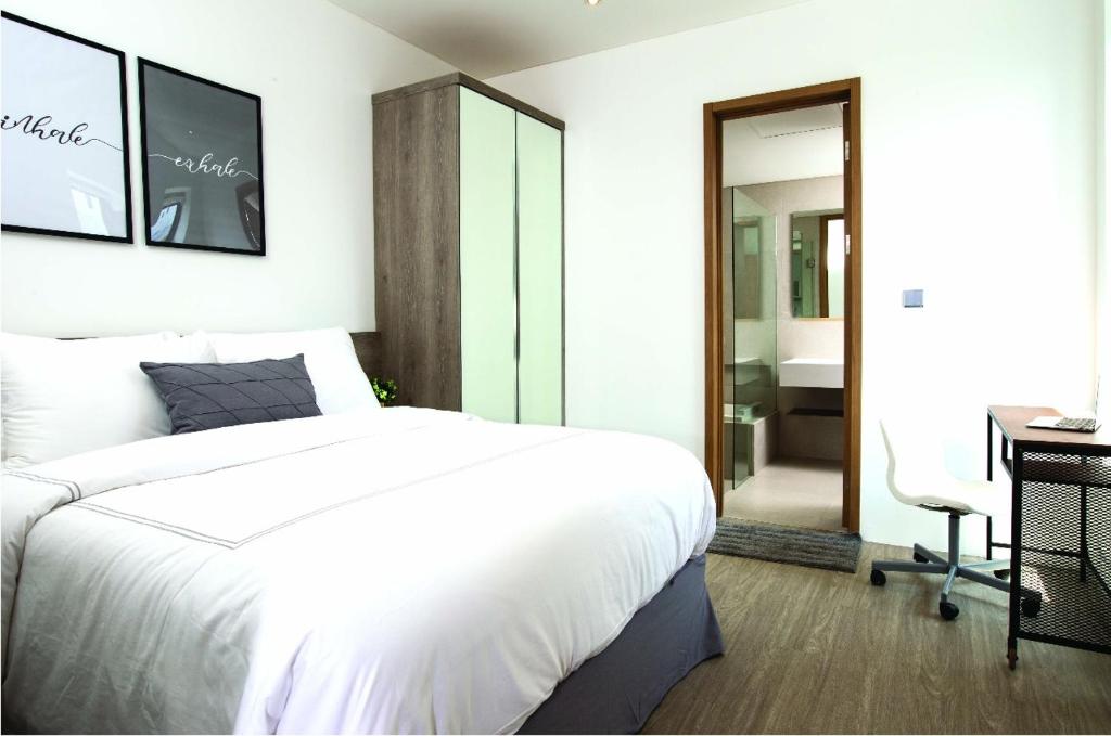 Voodi või voodid majutusasutuse Ariama Serviced Residence toas