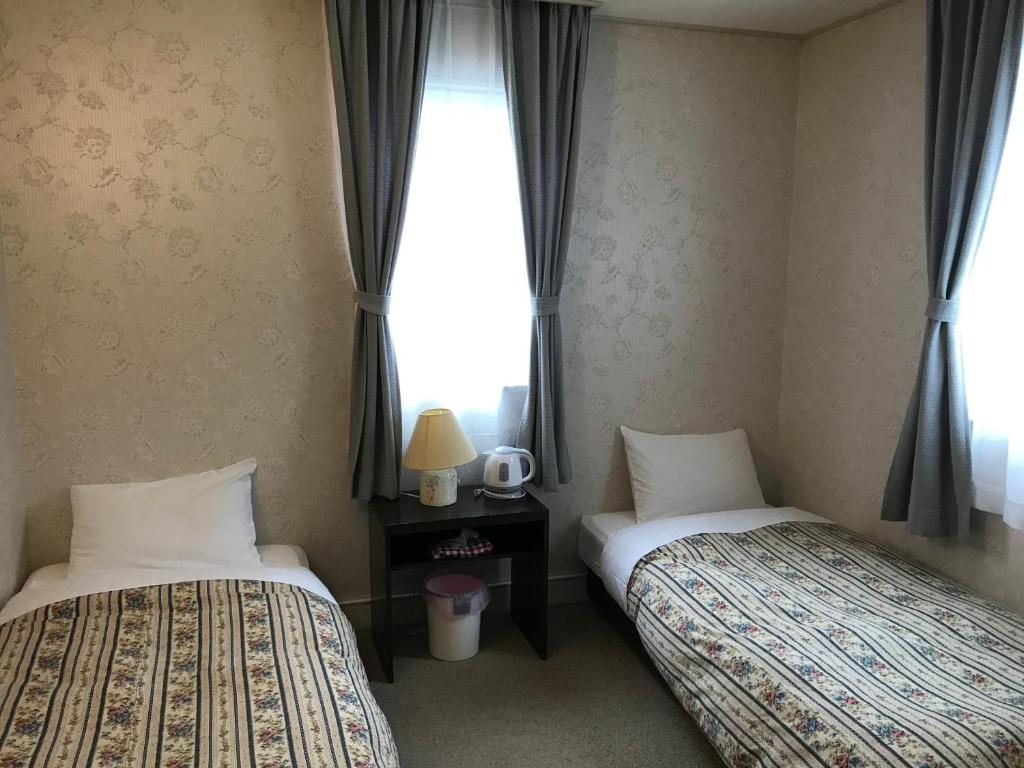 Postel nebo postele na pokoji v ubytování Petit Hotel Kurumi to Milk