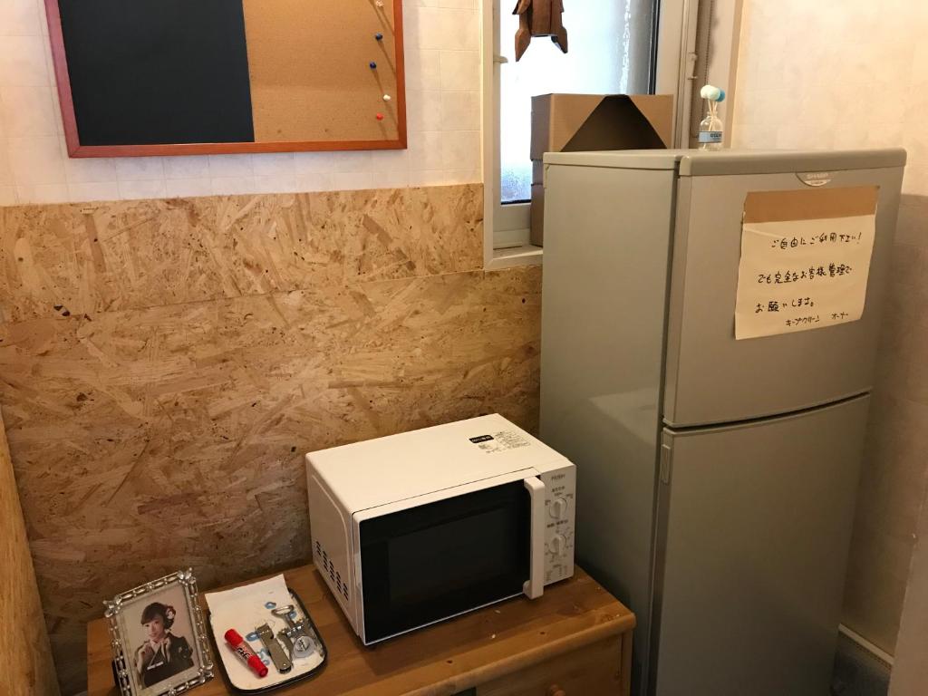 Kuchyň nebo kuchyňský kout v ubytování Petit Hotel Kurumi to Milk