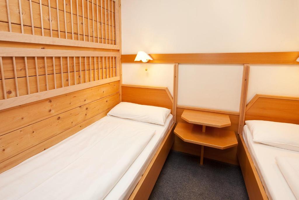 Postel nebo postele na pokoji v ubytování Appartement-Hotel Seespitz