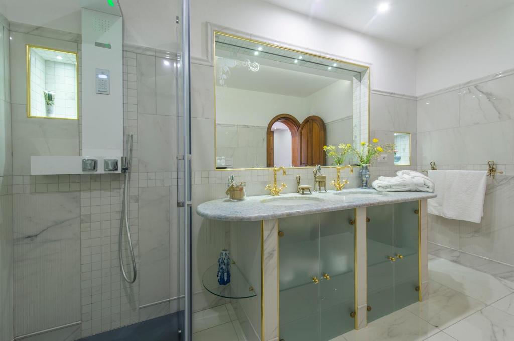 a bathroom with a sink and a shower at Villa Briganti Seaview Terrace in Positano