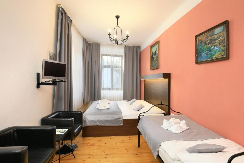 Postel nebo postele na pokoji v ubytování Hotel U Martina