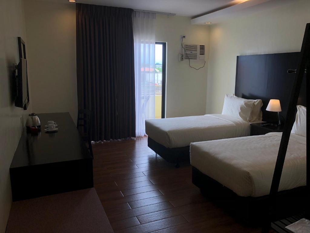 Postel nebo postele na pokoji v ubytování Piña Suites
