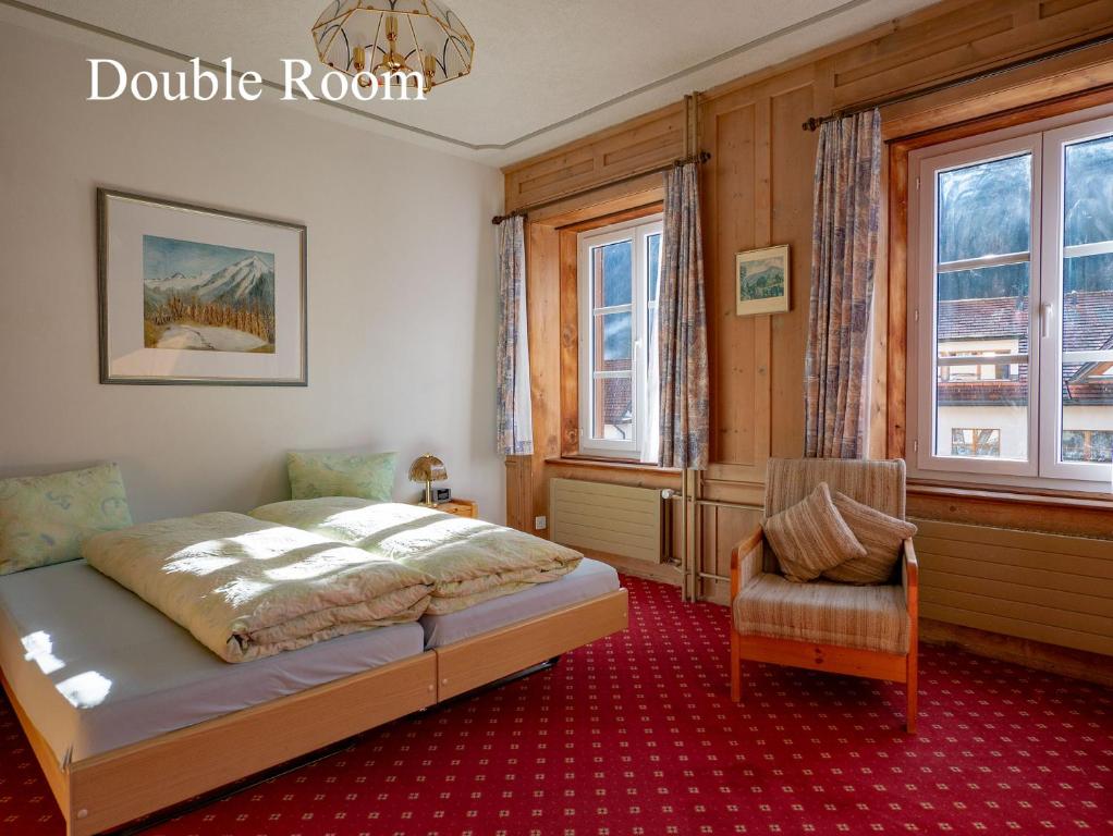 Postel nebo postele na pokoji v ubytování Hotel Restaurant Rätia
