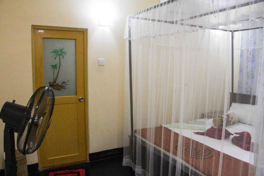 Postel nebo postele na pokoji v ubytování Manju Homestay