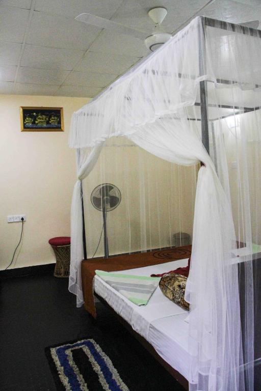 Postel nebo postele na pokoji v ubytování Manju Homestay