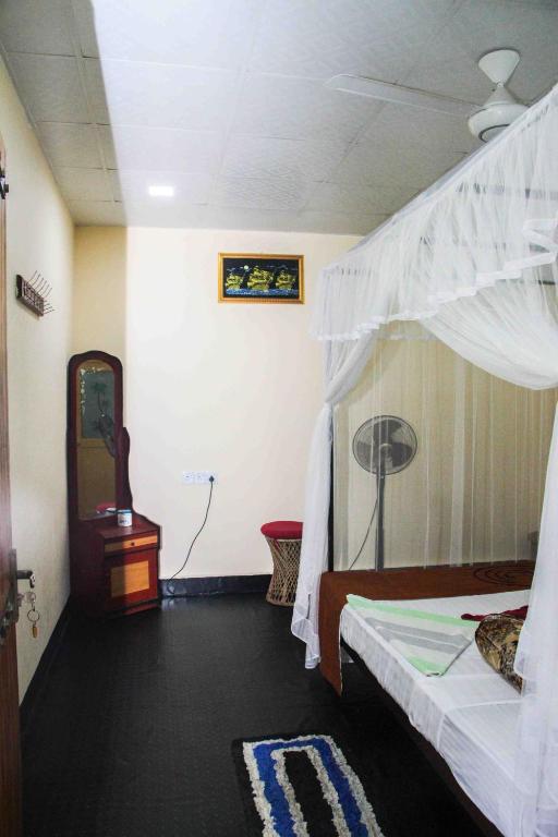Postel nebo postele na pokoji v ubytování Manju Homestay