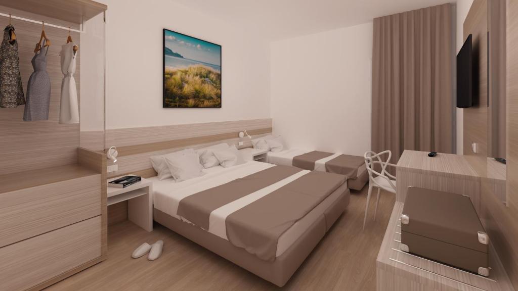 Postel nebo postele na pokoji v ubytování Hotel Portofino