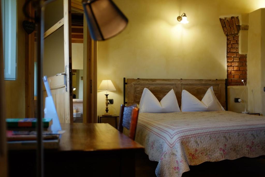 Postel nebo postele na pokoji v ubytování Agriturismo Cascina Pezzolo