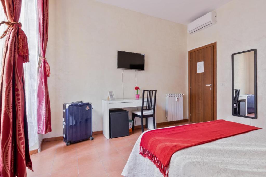 Posteľ alebo postele v izbe v ubytovaní Roma Enrico Guesthouse