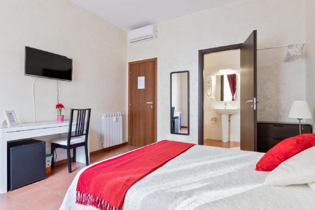 Posteľ alebo postele v izbe v ubytovaní Roma Enrico Guesthouse