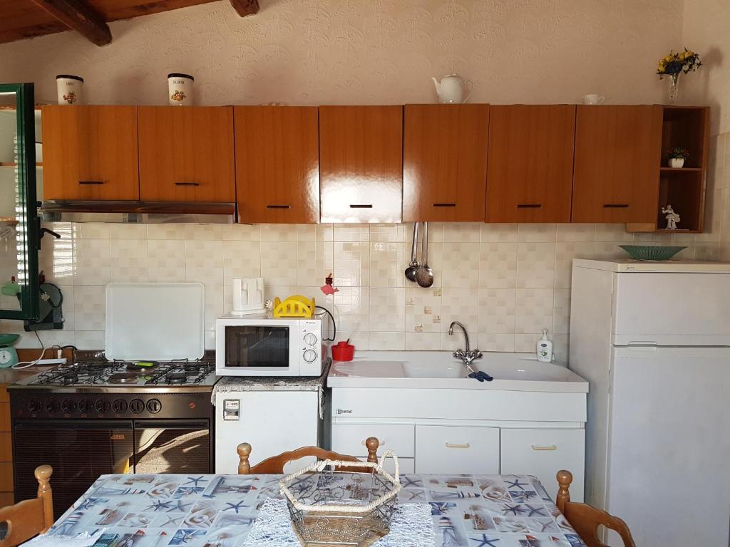 Kuchyň nebo kuchyňský kout v ubytování casa fronte mare puro relax