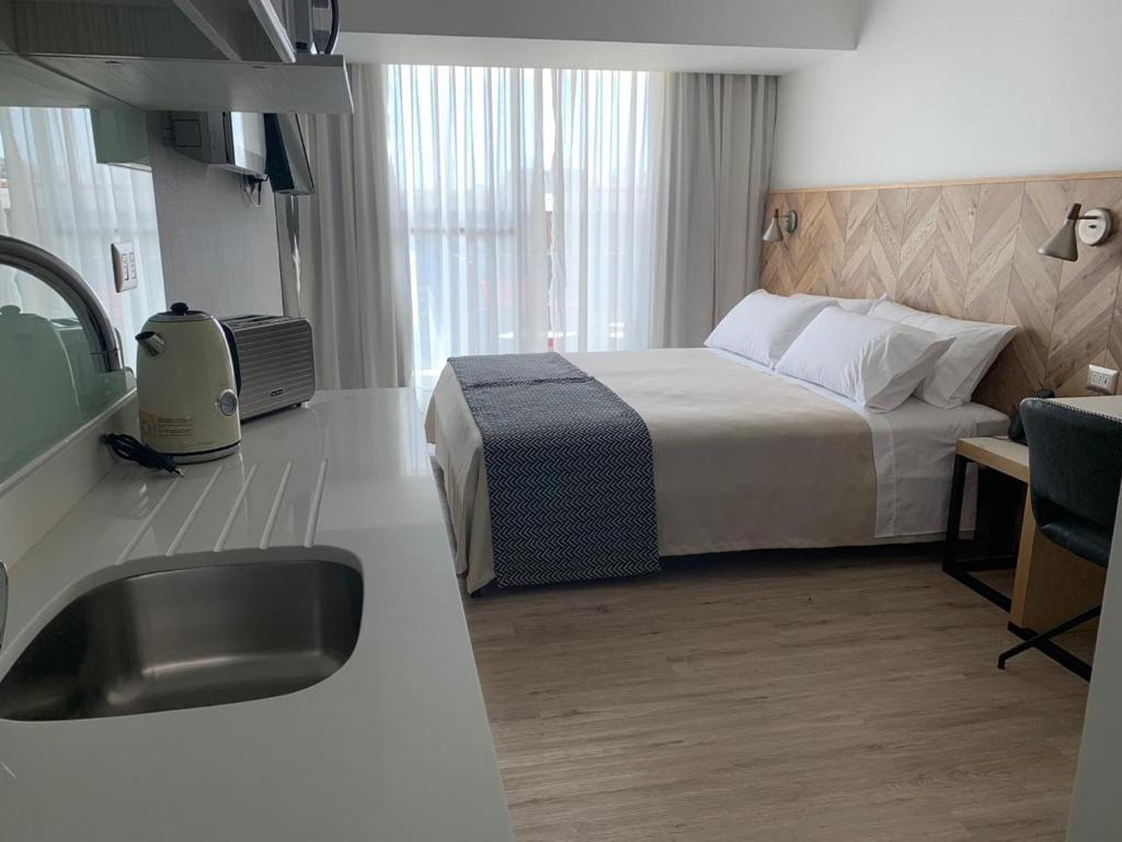 Postel nebo postele na pokoji v ubytování RQ Antofagasta