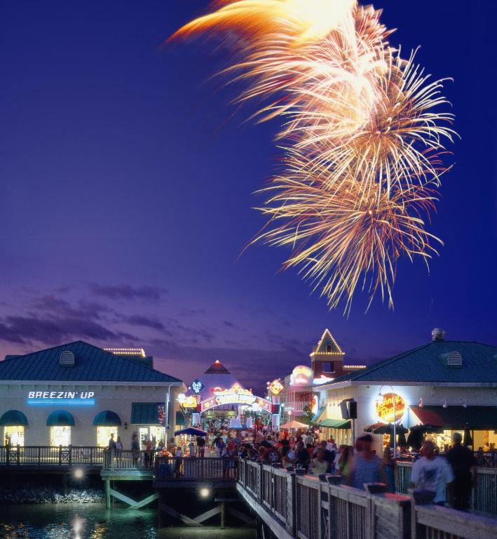 a crowd of people watching a fireworks display at a carnival at Marina Inn at Grande Dunes in Myrtle Beach