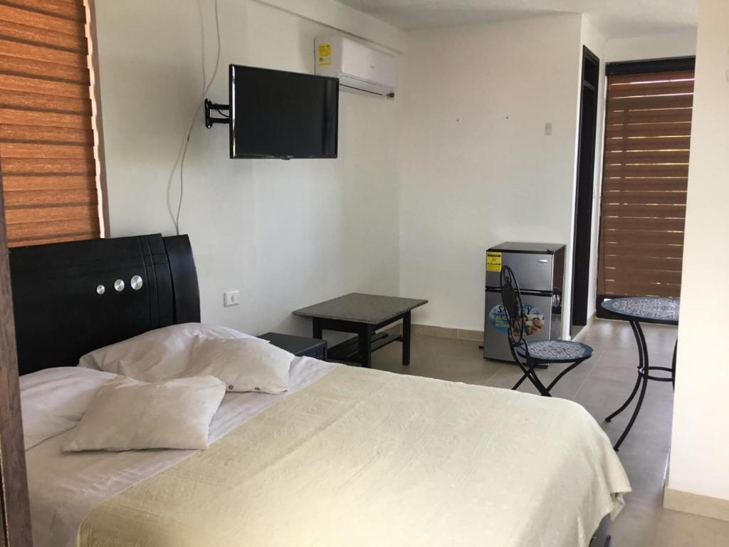 Postel nebo postele na pokoji v ubytování Apartamento Opaa