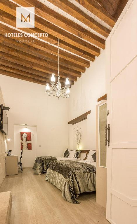 Postel nebo postele na pokoji v ubytování M Hoteles Concepto