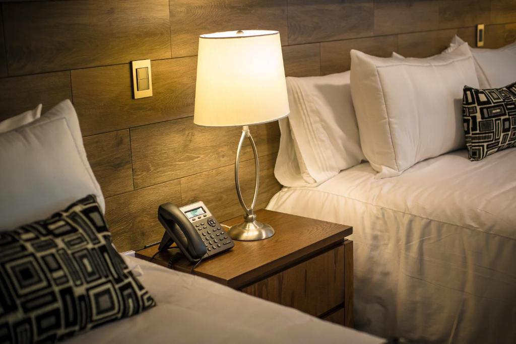 Postel nebo postele na pokoji v ubytování Hotel Corral Grande
