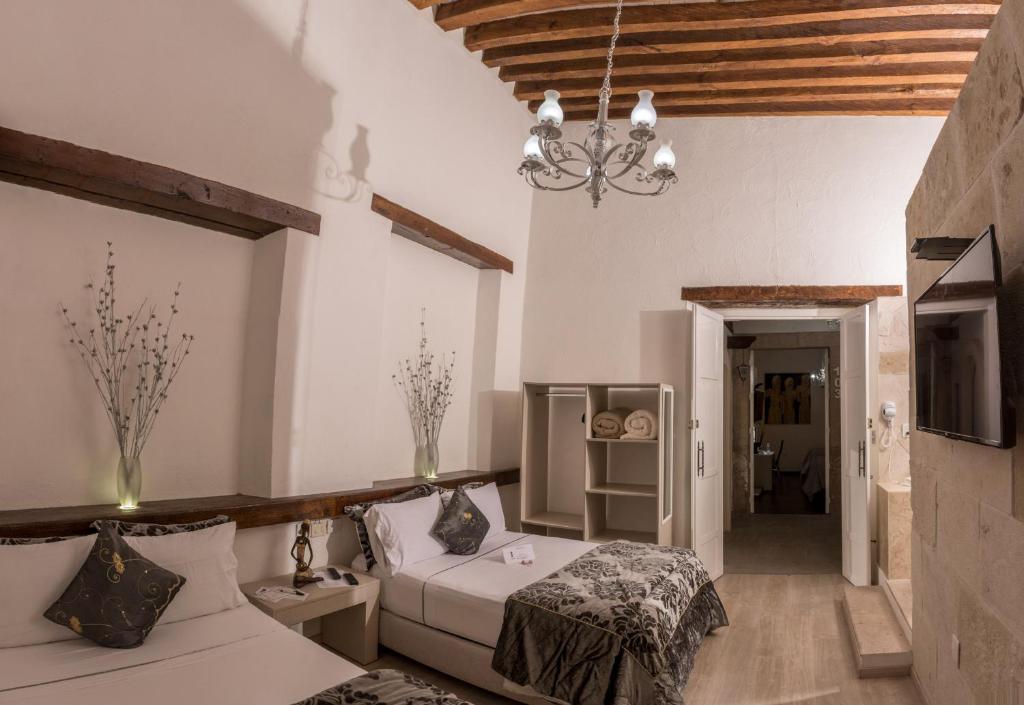 Postel nebo postele na pokoji v ubytování M Hoteles Concepto