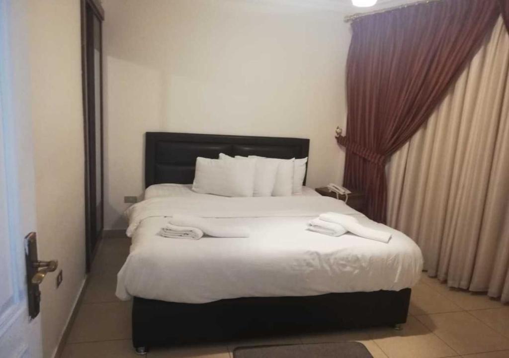 Ένα ή περισσότερα κρεβάτια σε δωμάτιο στο Shami Plaza Hotel